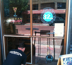 Man Repairing a Storefront Window